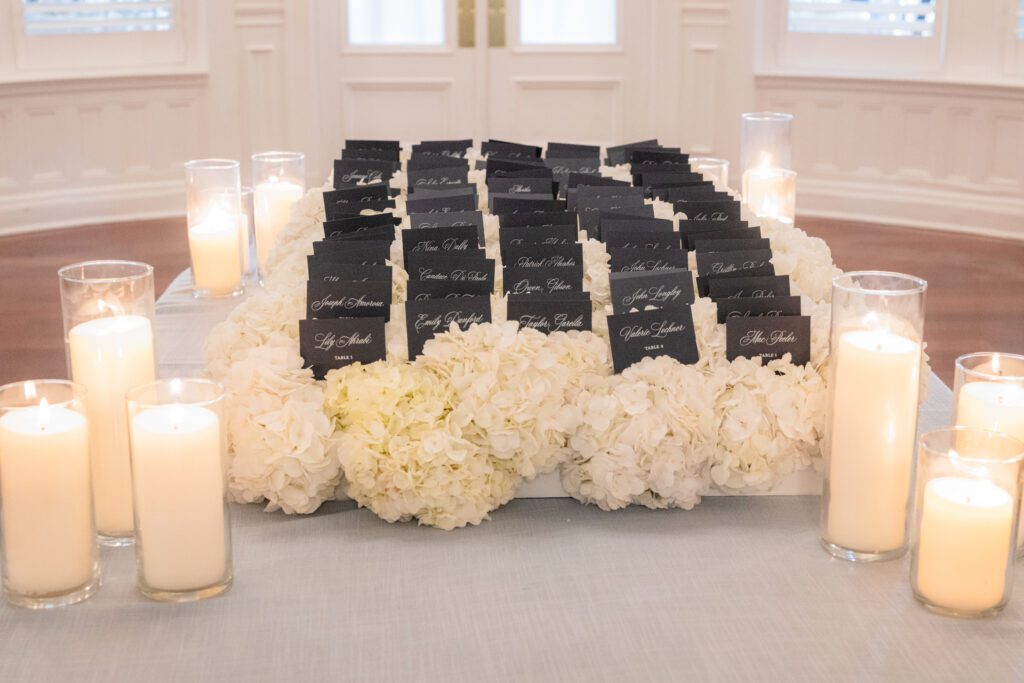 Welcome table with pillar candles at Ocean Cliff in Newport RI 